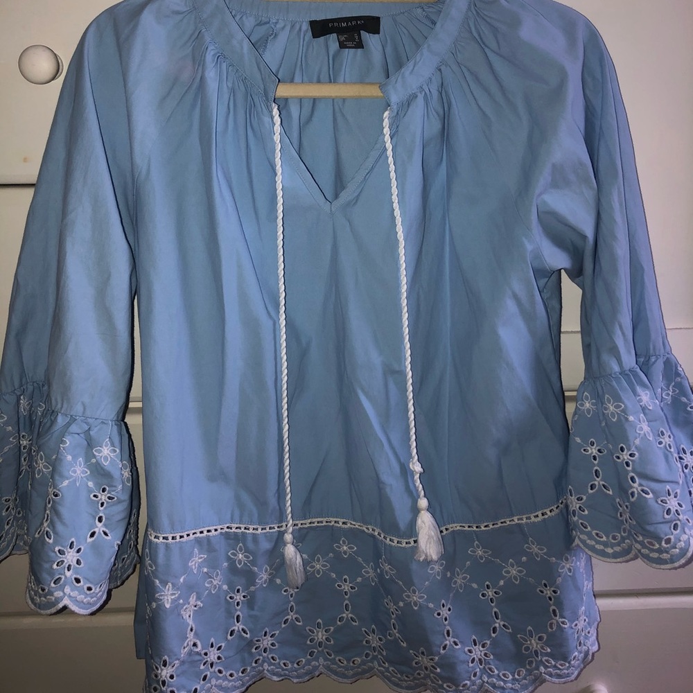 Light blue long bell sleeve blouse